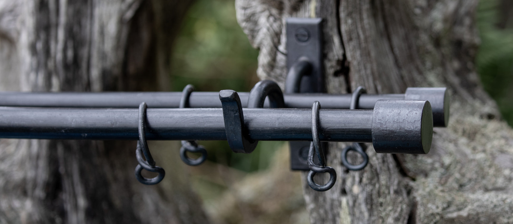 Double wrought iron curtain pole with short barrels