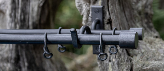 Double wrought iron curtain pole with short barrels