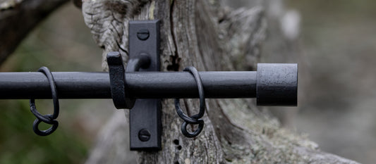 Wrought iron curtain pole with short barrels